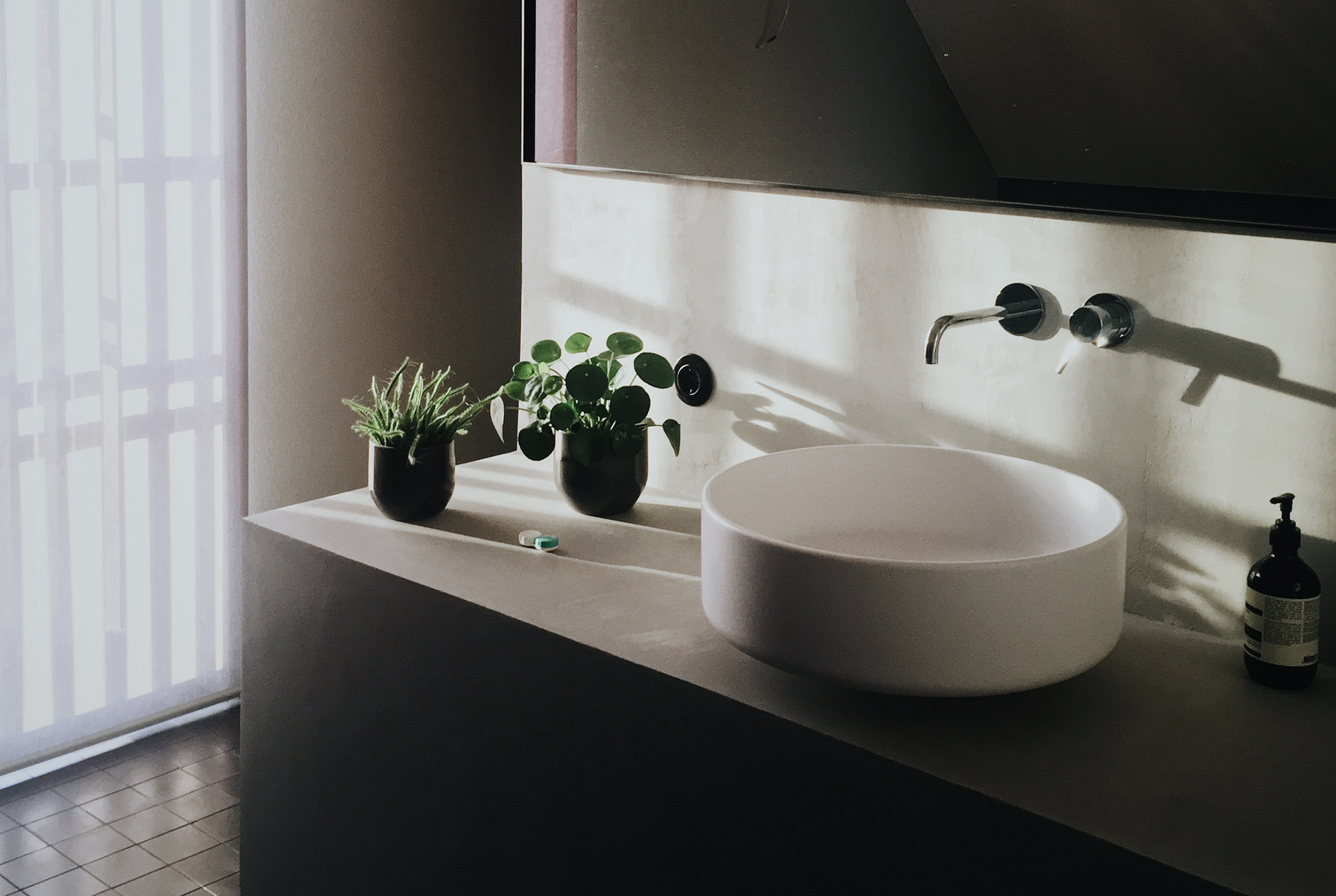 White sink with tan vanity